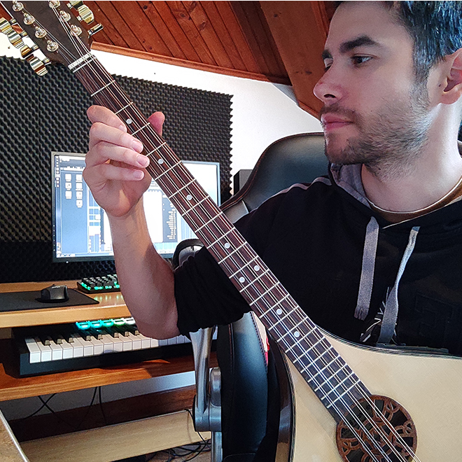 Nico composing on mandolin